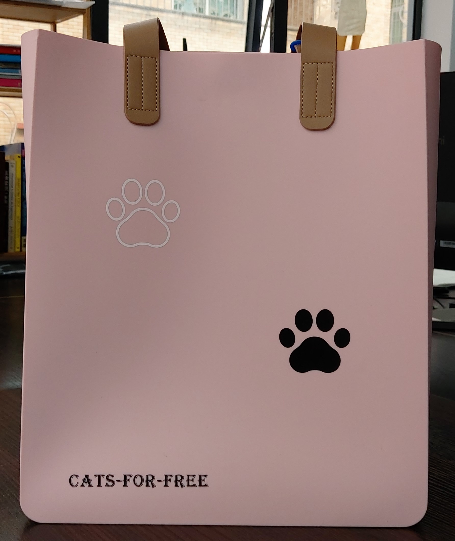 pink silicone bag with cat paws logo